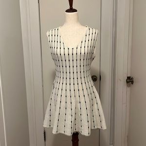 Sleeveless cream and black peplum top size small